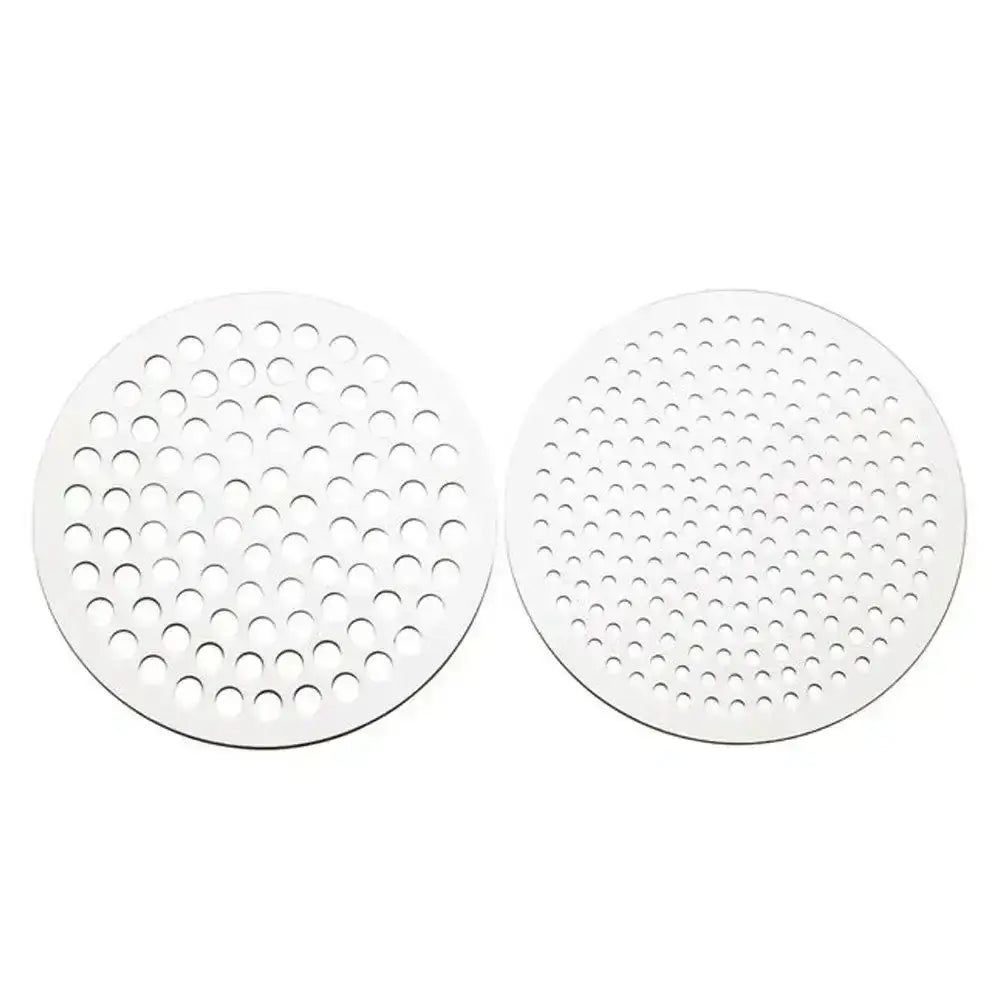 Two round white silicone mats with a grid pattern on a white background