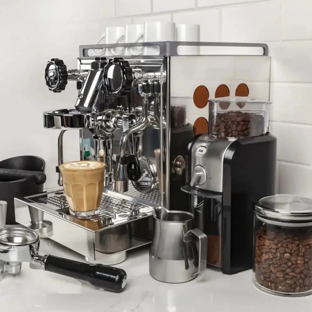 Espresso machine on a kitchen counter with coffee beans and accessories.