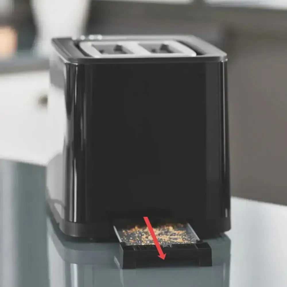 Black electronic device with a clear cover on a reflective surface
