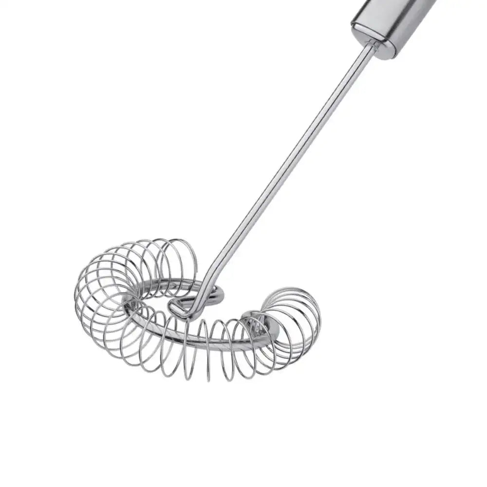 Metallic whisk on a white background