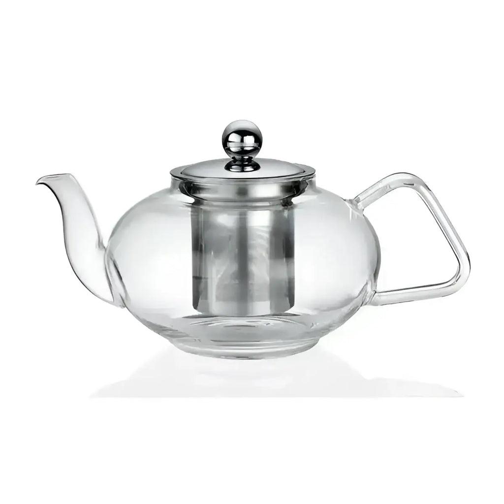 Clear glass teapot with metal lid and handle on a white background