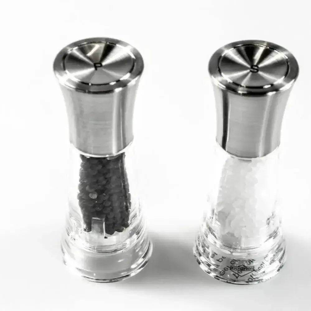 Two stainless steel salt and pepper shakers on a white background