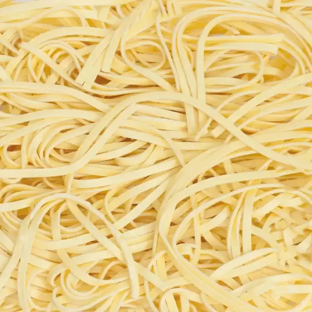 Close-up of uncooked yellow pasta strands