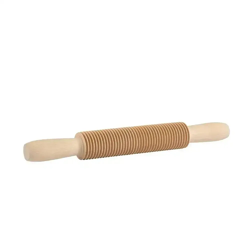 Wooden rolling pin with a ribbed design on a white background