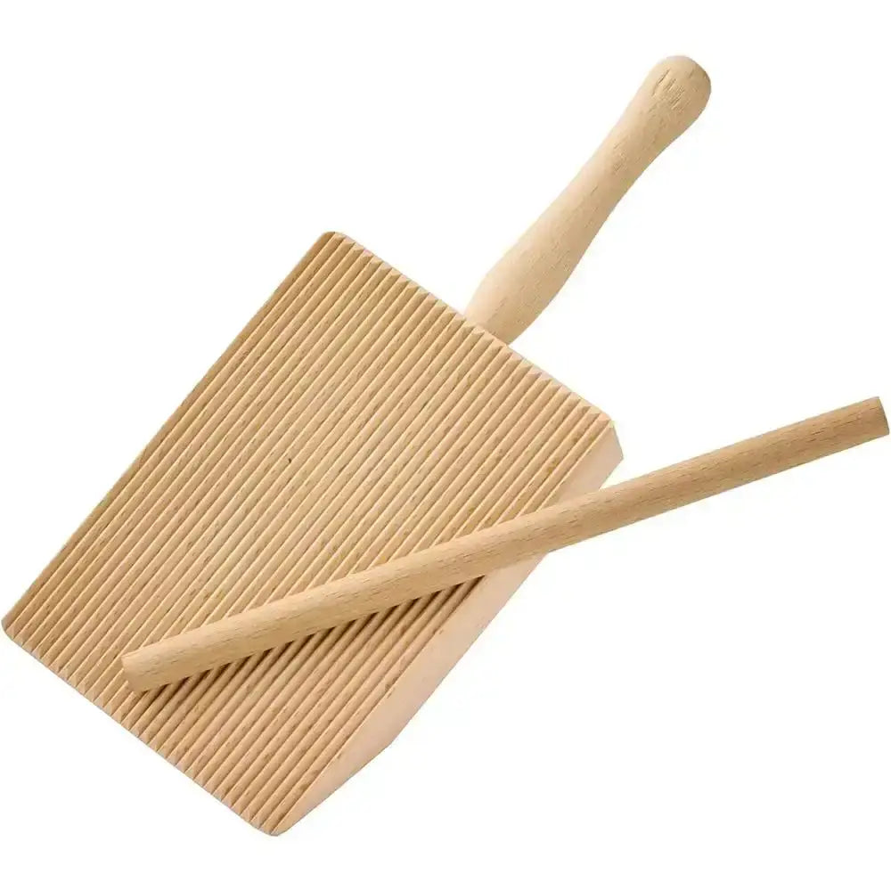 Wooden gnocchi shaping paddle with a handle on a white background