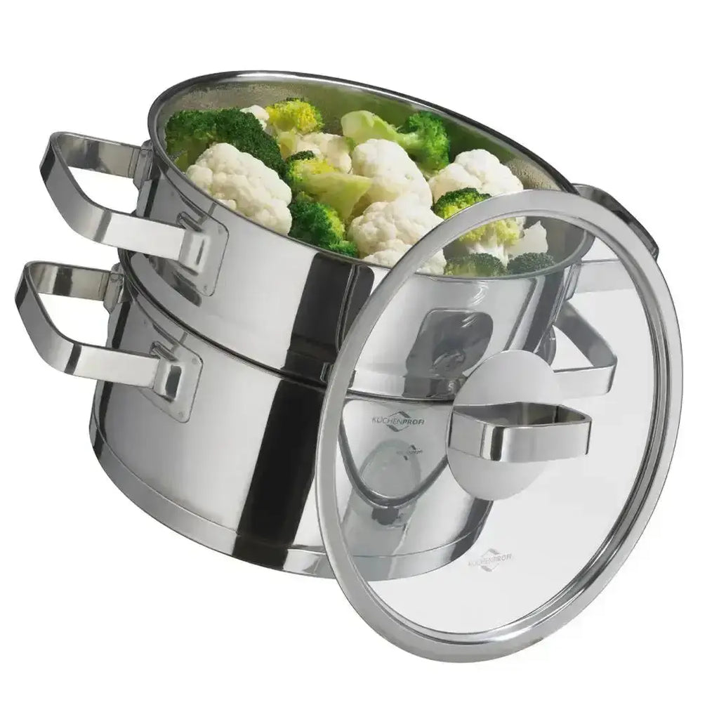 Stainless steel pot with vegetables inside on a white background