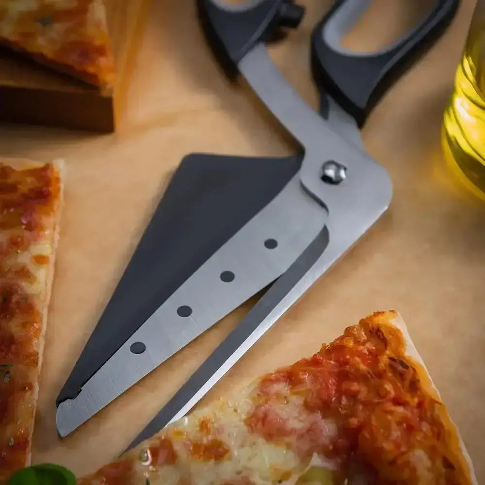 Pair of pizza scissors on a wooden board with pizza slices