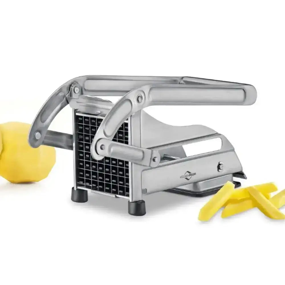 Metallic potato peeler with a lemon and peels on a white background
