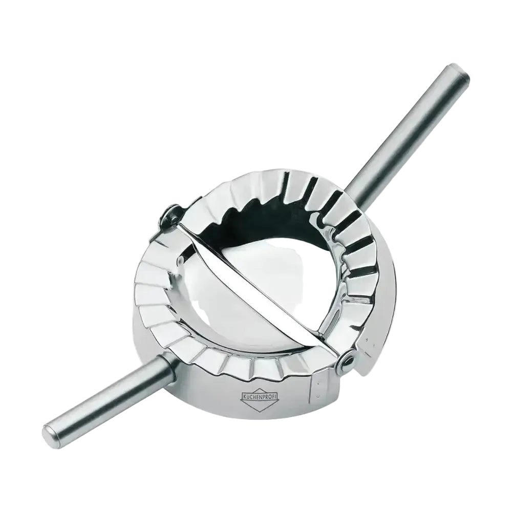 Metallic ravioli maker on a white background
