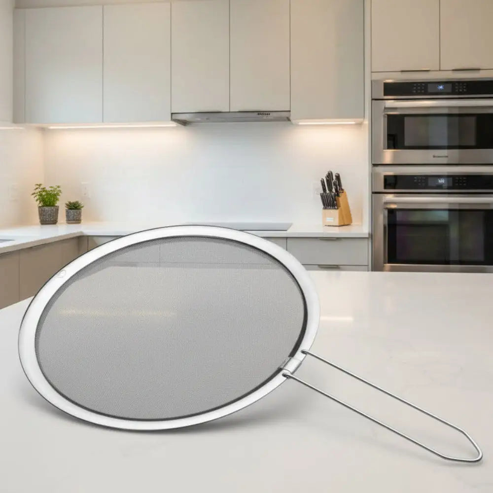 Metal strainer with handle on a white background