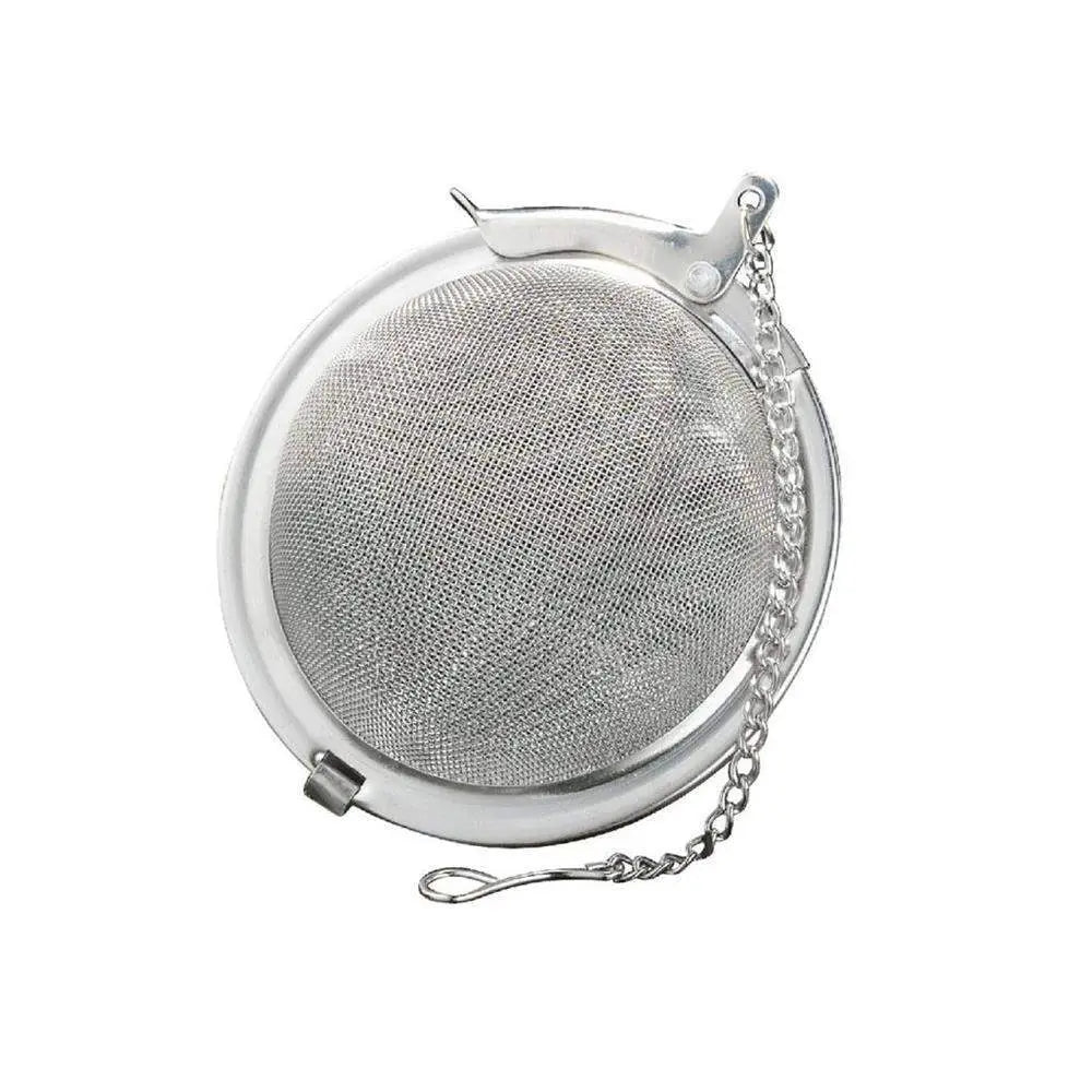 Metallic tea ball with mesh design on a white background