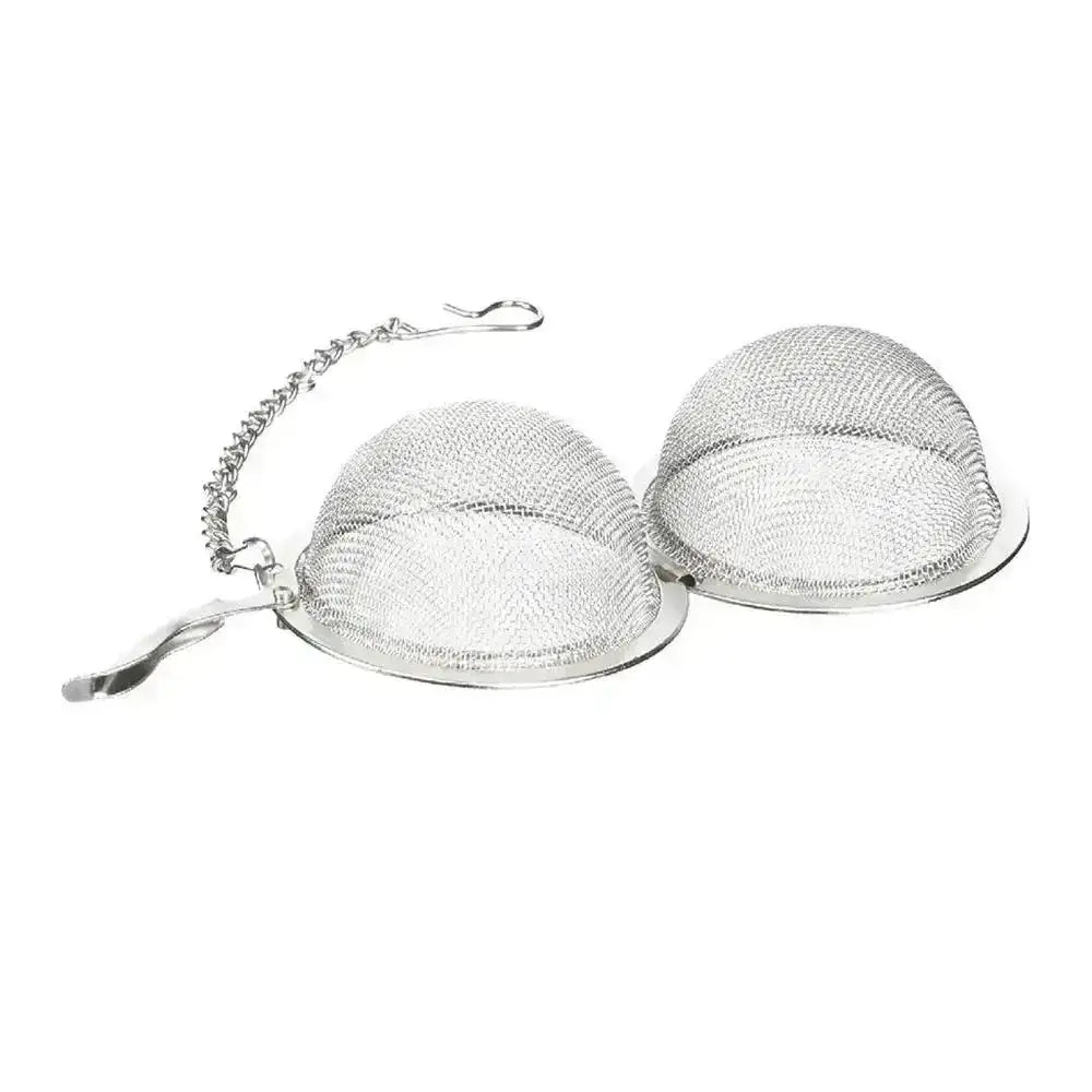 Metallic tea ball infuser on a white background
