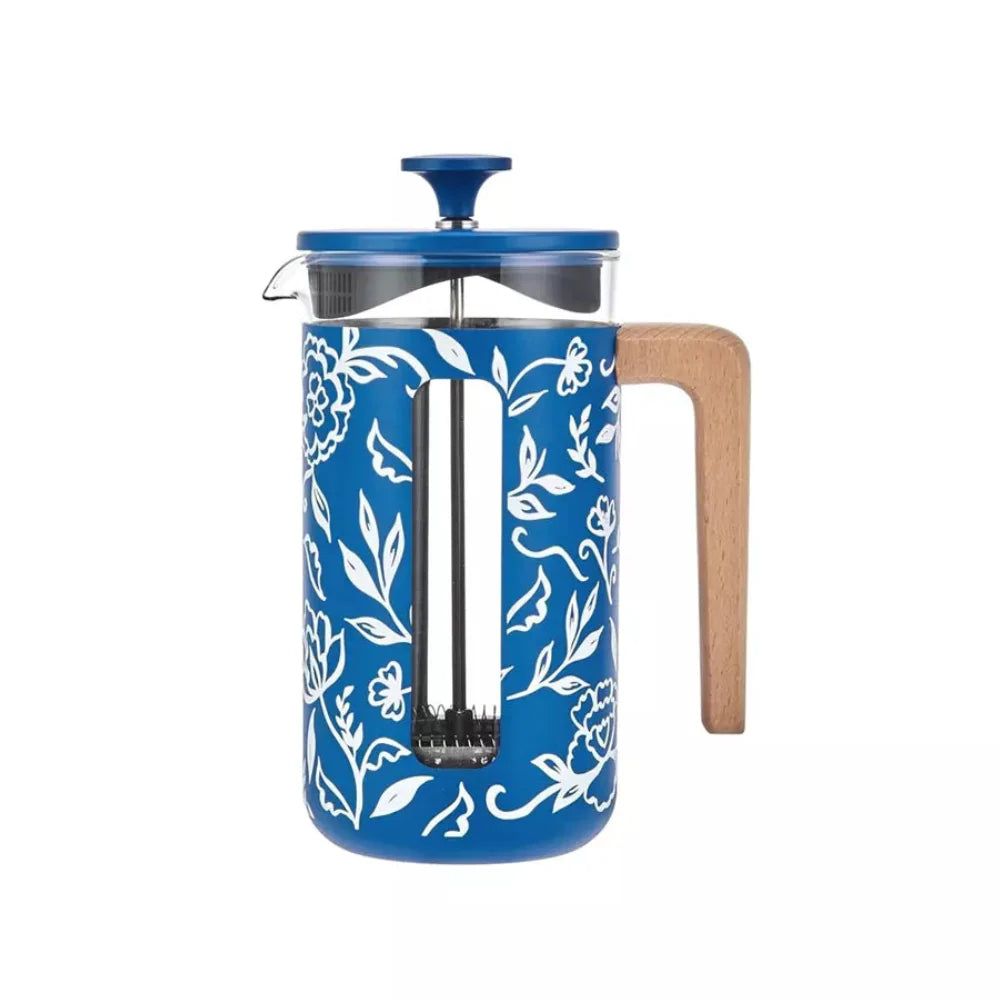 Blue floral-patterned French press with wooden handle on a white background