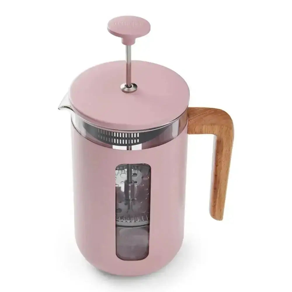 Pink French press coffee maker with wooden handle on a white background