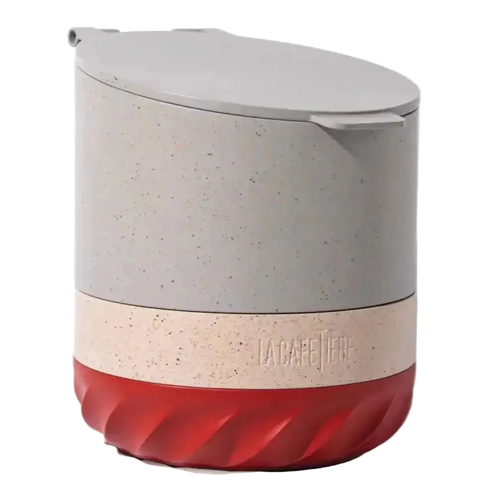 Multicolored container with speckled pattern and red base on a white background