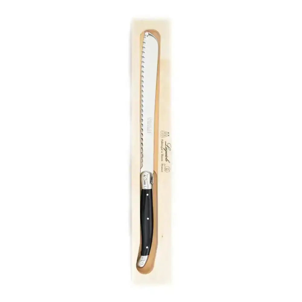 Serrated knife with black handle in wooden box on white background