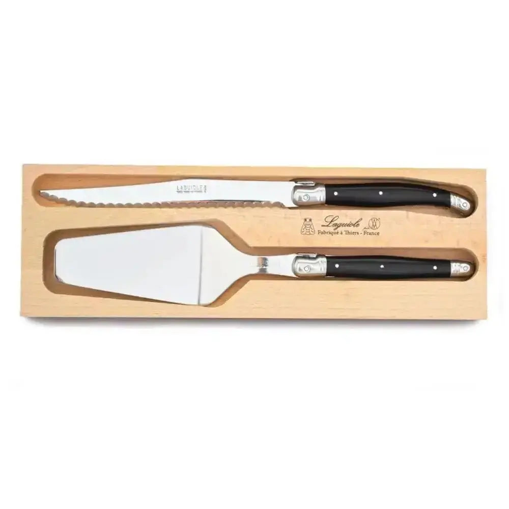 Two knives with black handles in a wooden box on a white background