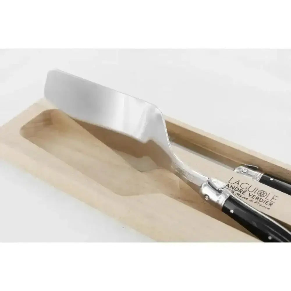 Metal spatula with wooden handle on a white background