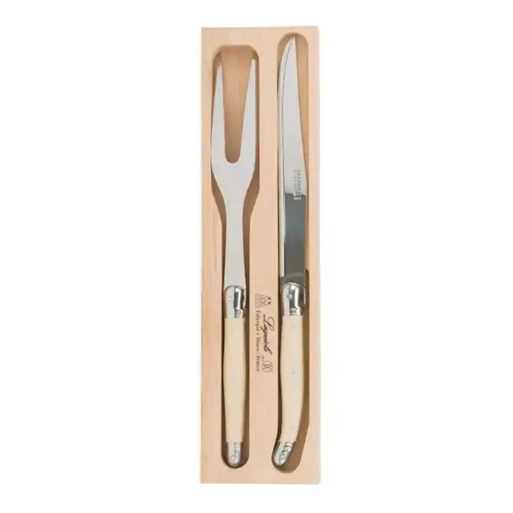 Set of steak knife and fork in wooden packaging on a white background