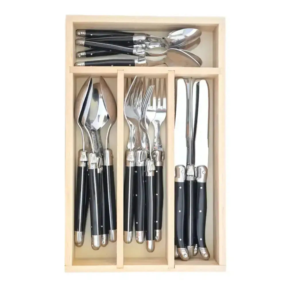 Set of cutlery with black handles in a wooden organizer on a white background