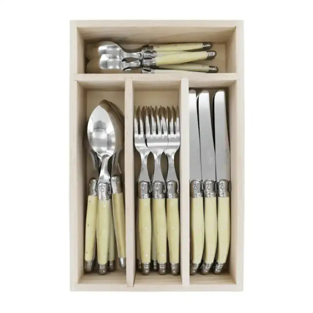 Set of cutlery with ivory handles in a wooden box on a white background