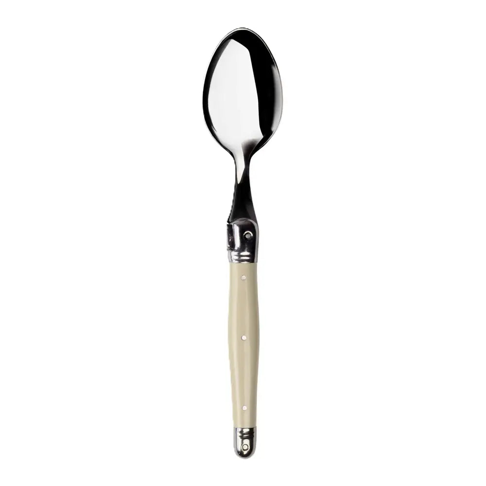 Spoon with a beige handle on a white background