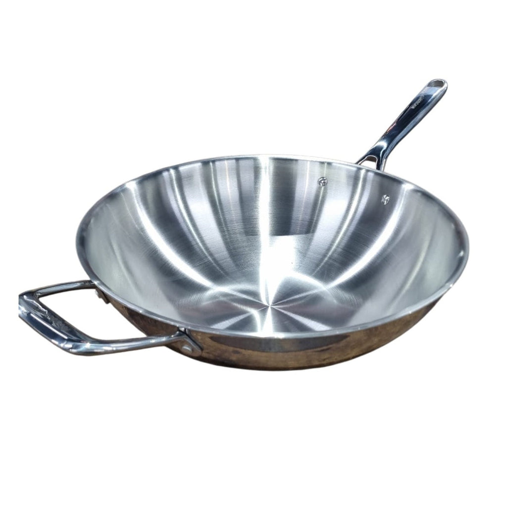 Stainless steel wok on white background