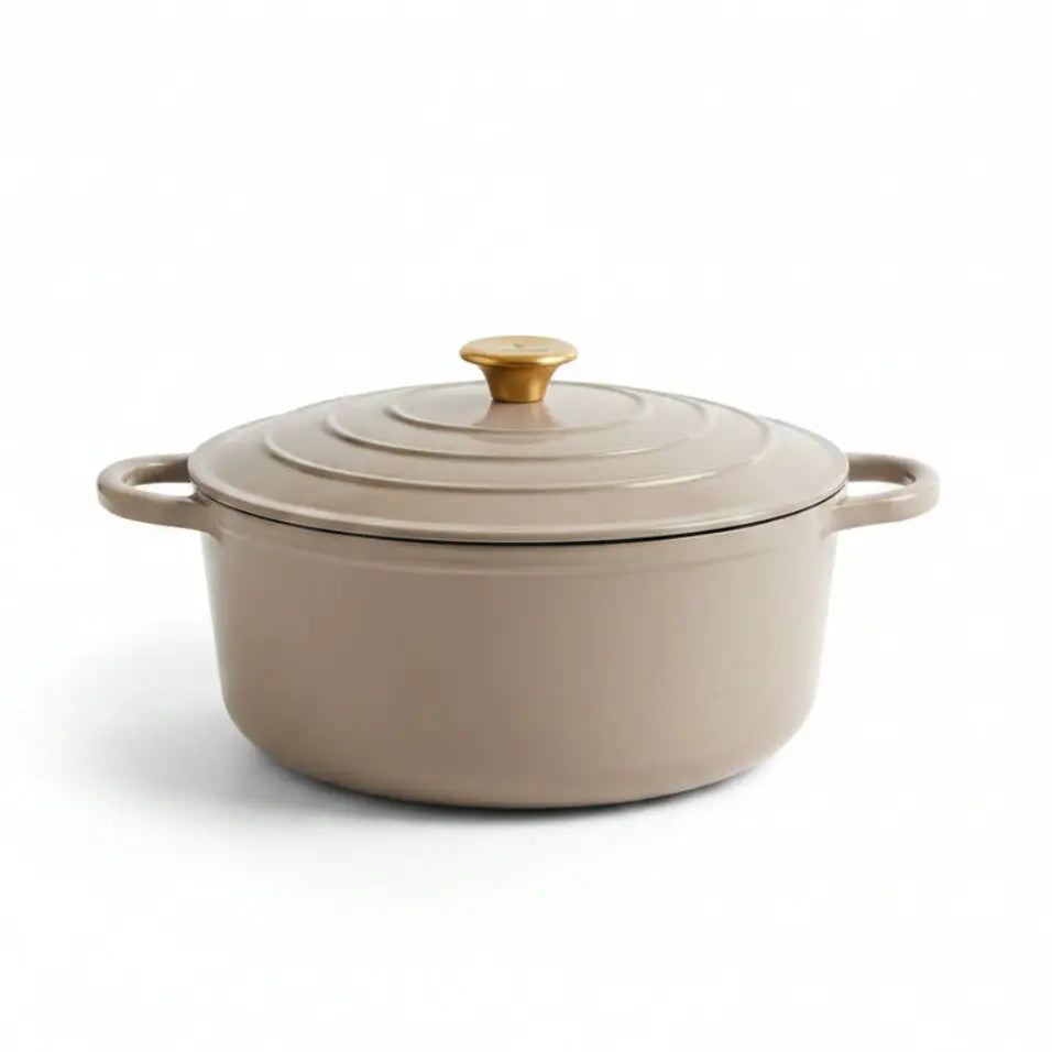 Beige enameled cast iron Dutch oven with a lid on a white background