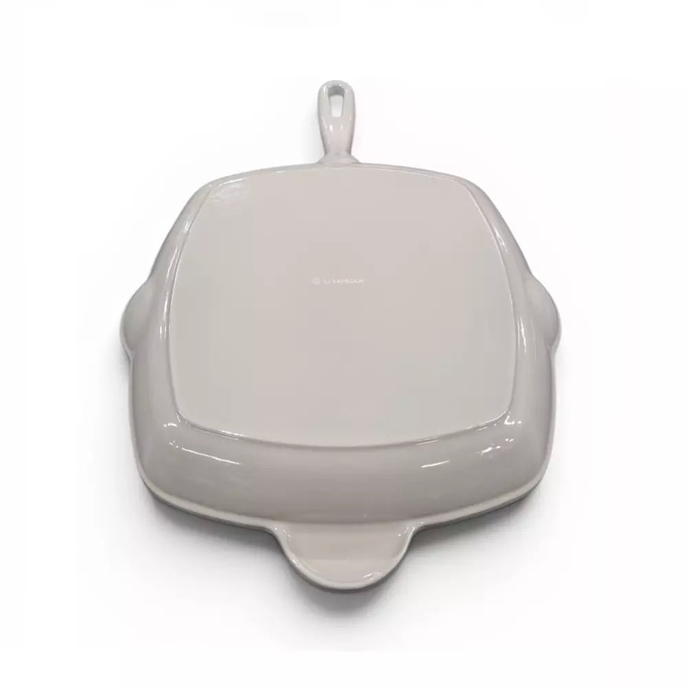 Beige cast iron grill pan on white background