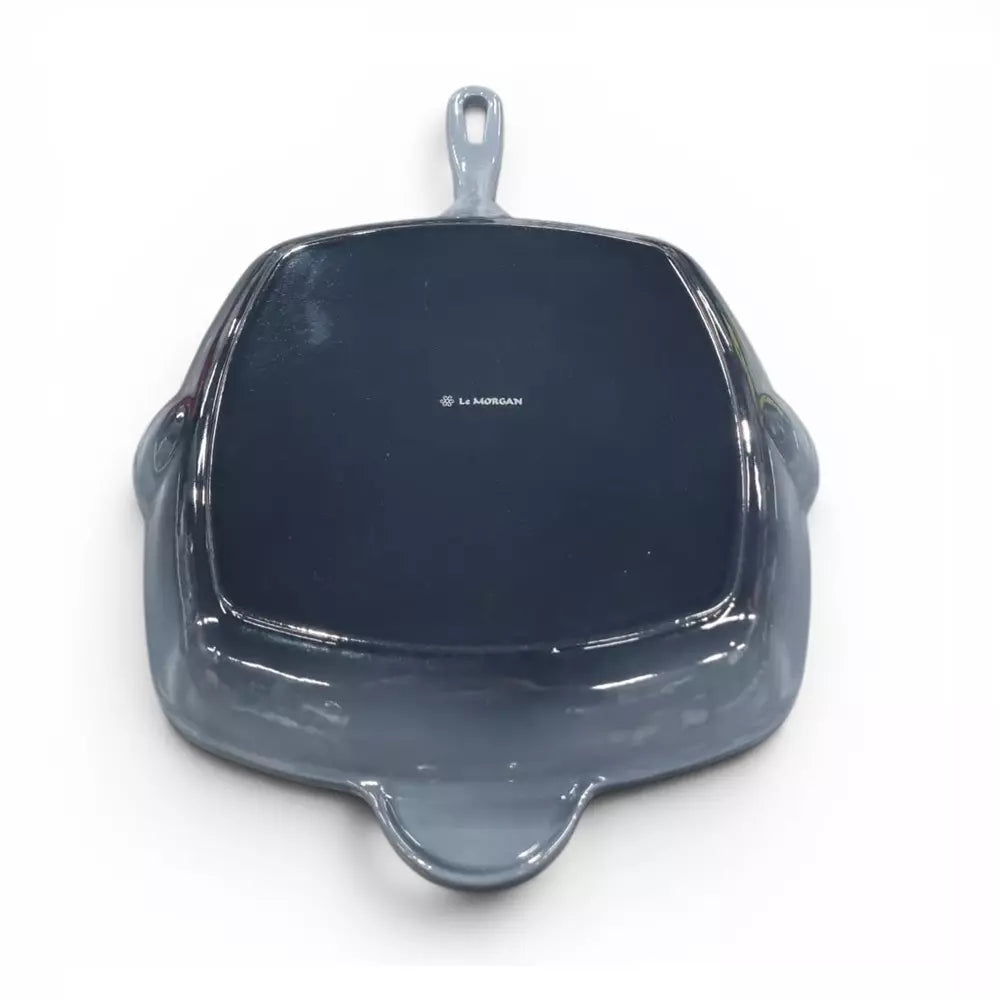 Grey cast iron enamel grill pan on white background