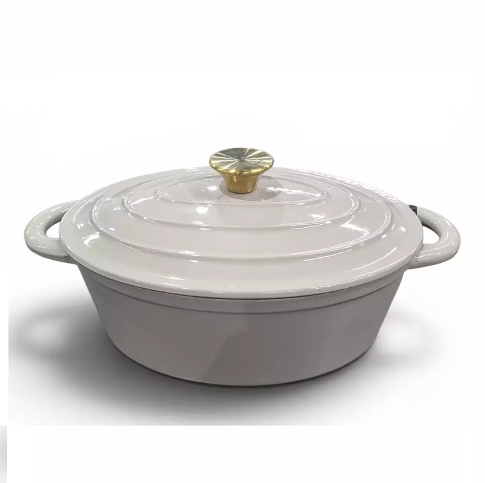 Beige cast iron enamel casserole pot with lid on a white background