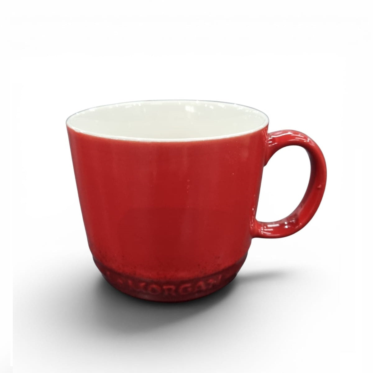 Red mug with white interior on a white background
