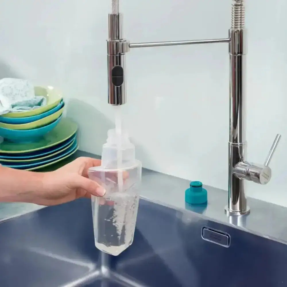Person using a water filter in a kitchen sink with a modern faucet.