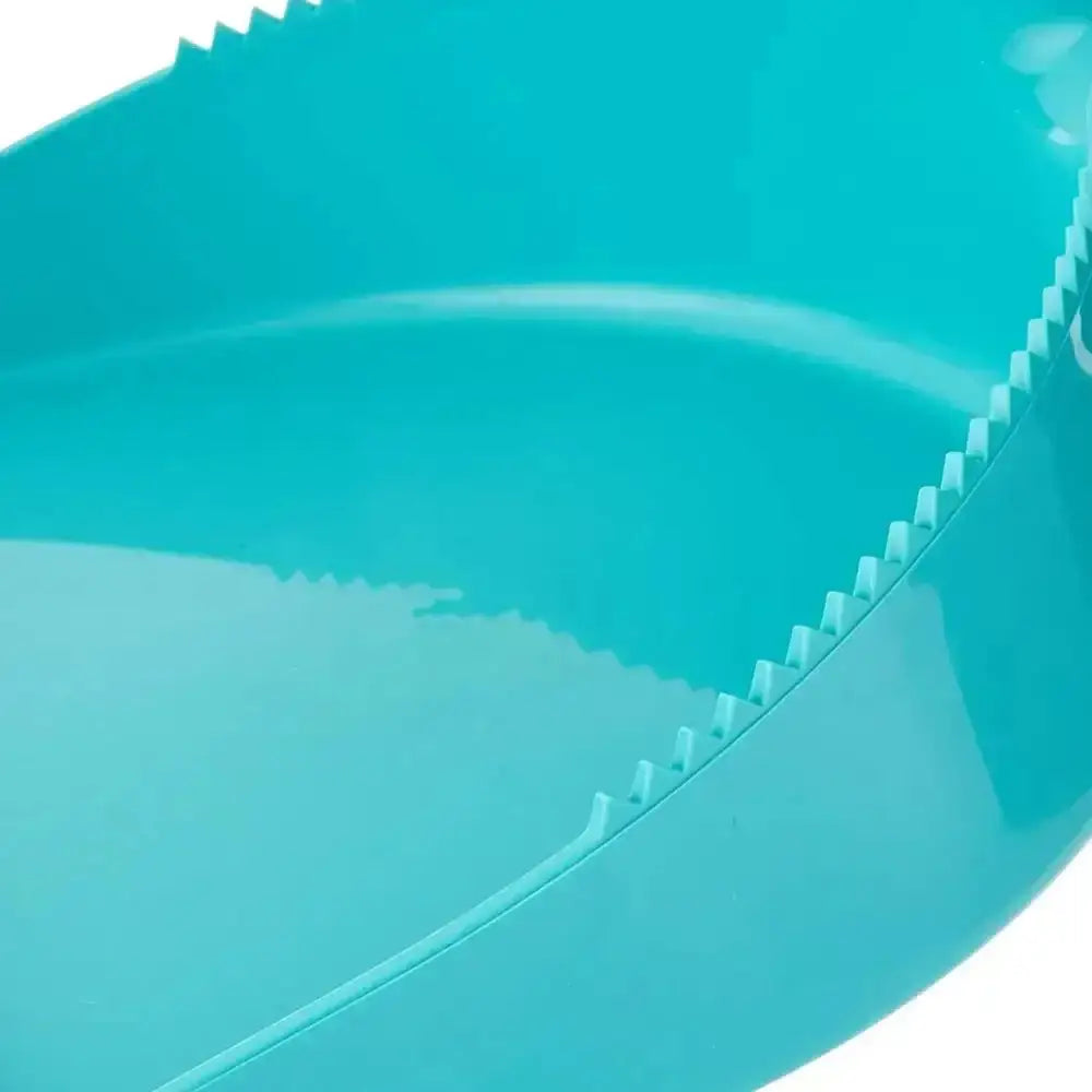 Close-up of a blue plastic product with textured edge on a white background