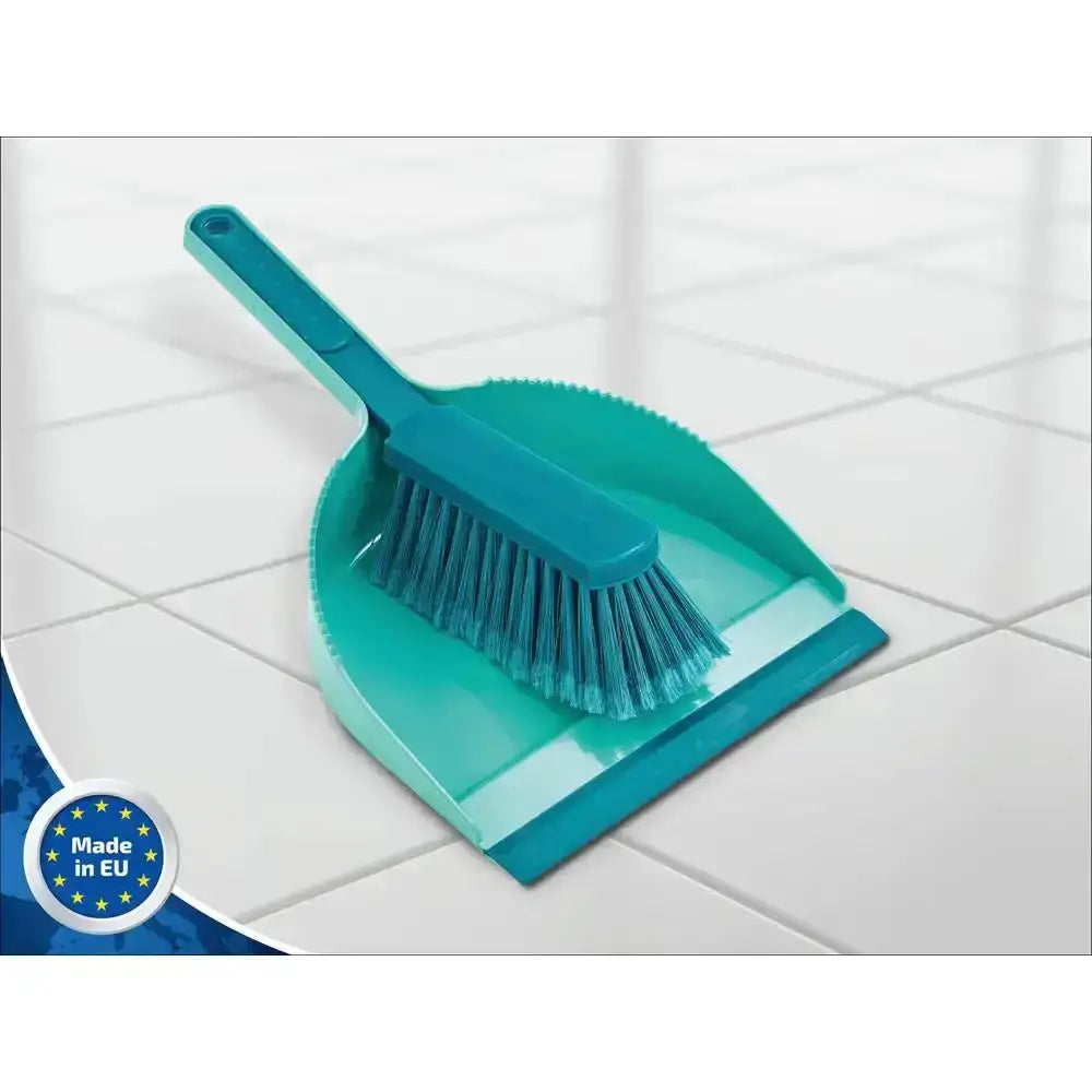 Turquoise cleaning brush and dustpan set on a tiled floor with 'Made in EU' label.