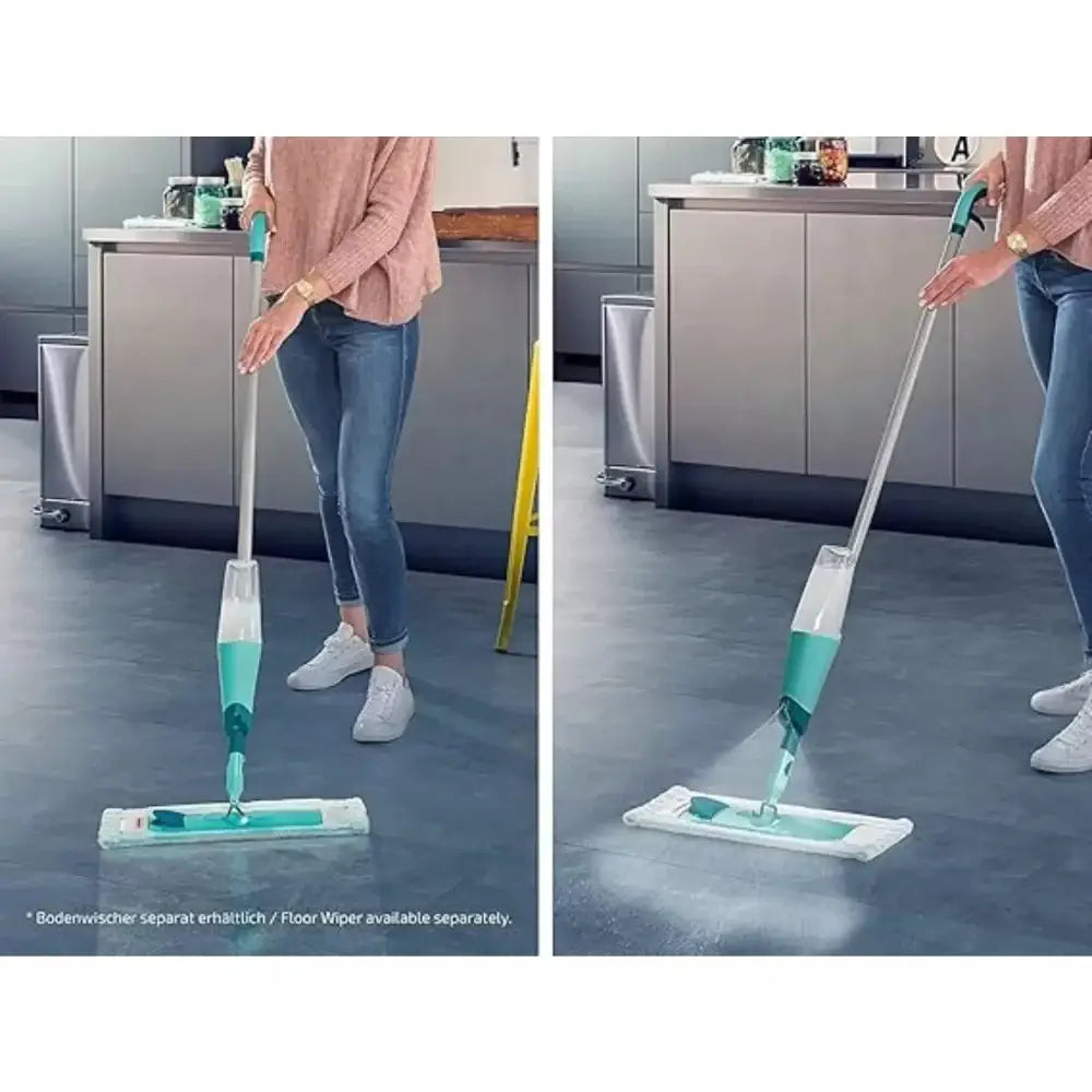 Person using a floor cleaning device on a kitchen floor