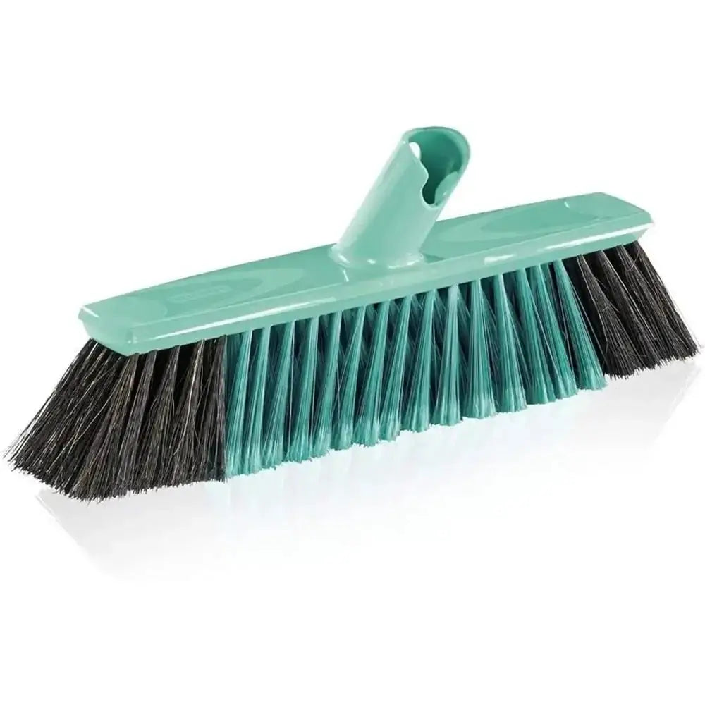 Cleaning brush with black bristles and a green handle on a white background