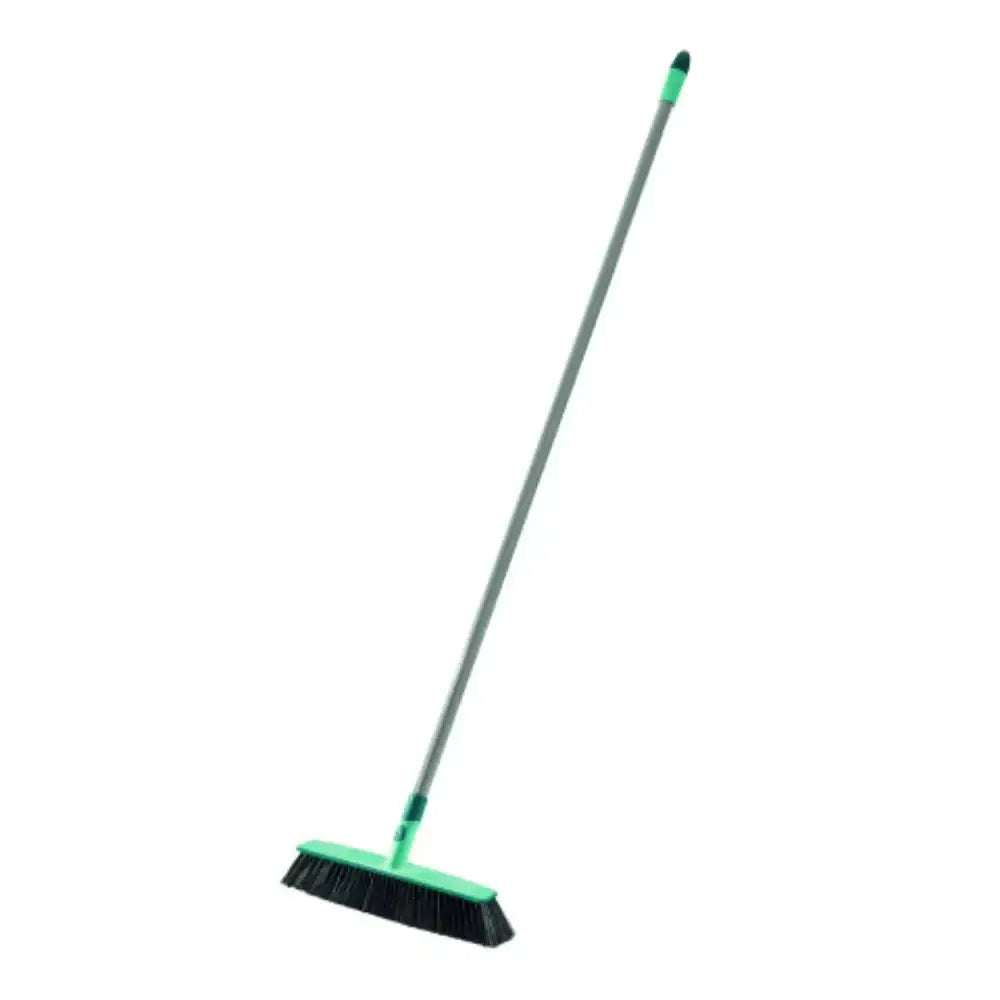 Green broom with a long handle on a white background