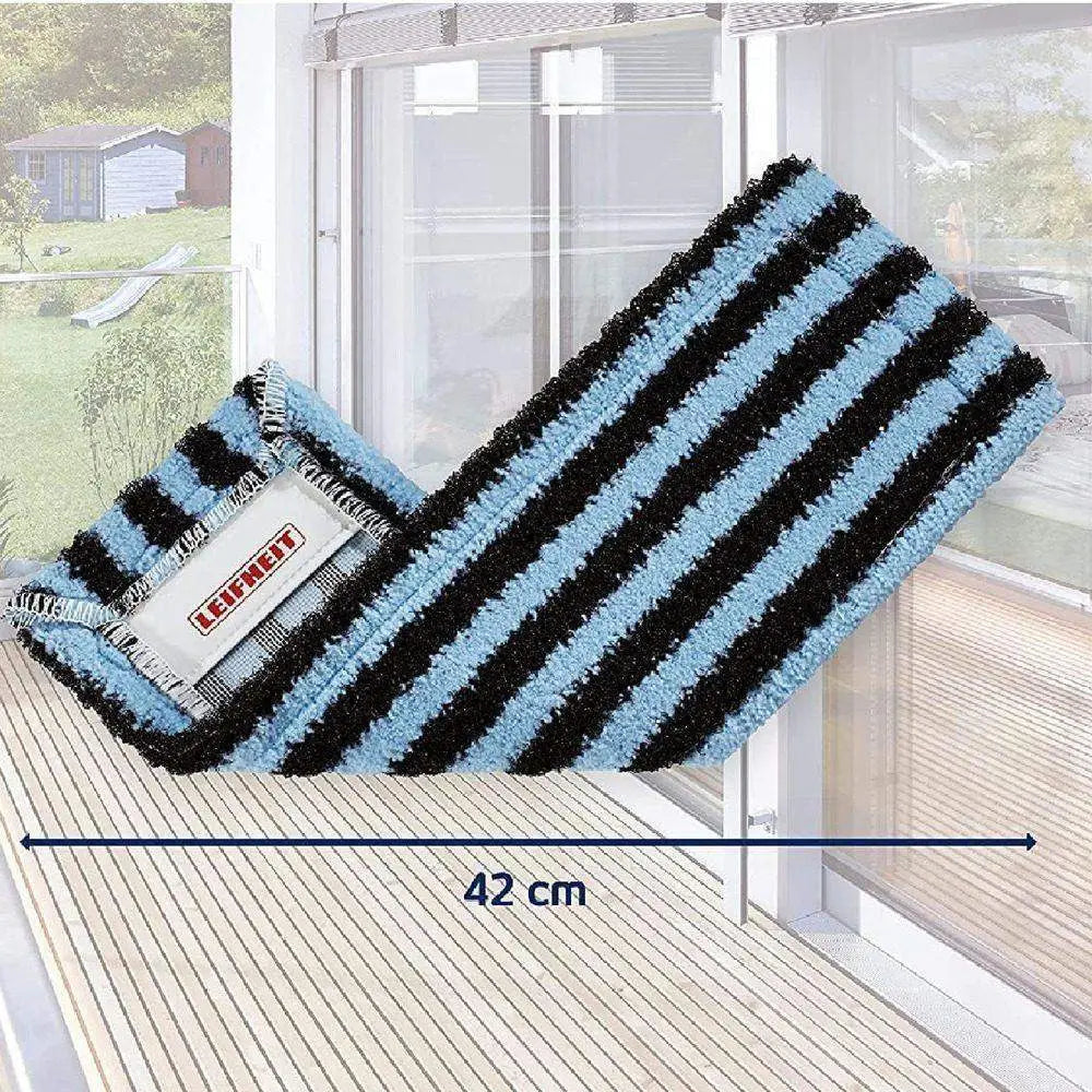 Striped blue and black mat with a brand label on a wooden surface, showing dimensions.