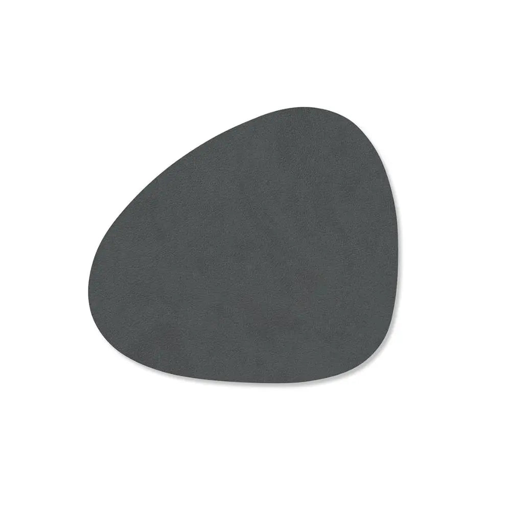 leather coaster with textured surface on a white background
