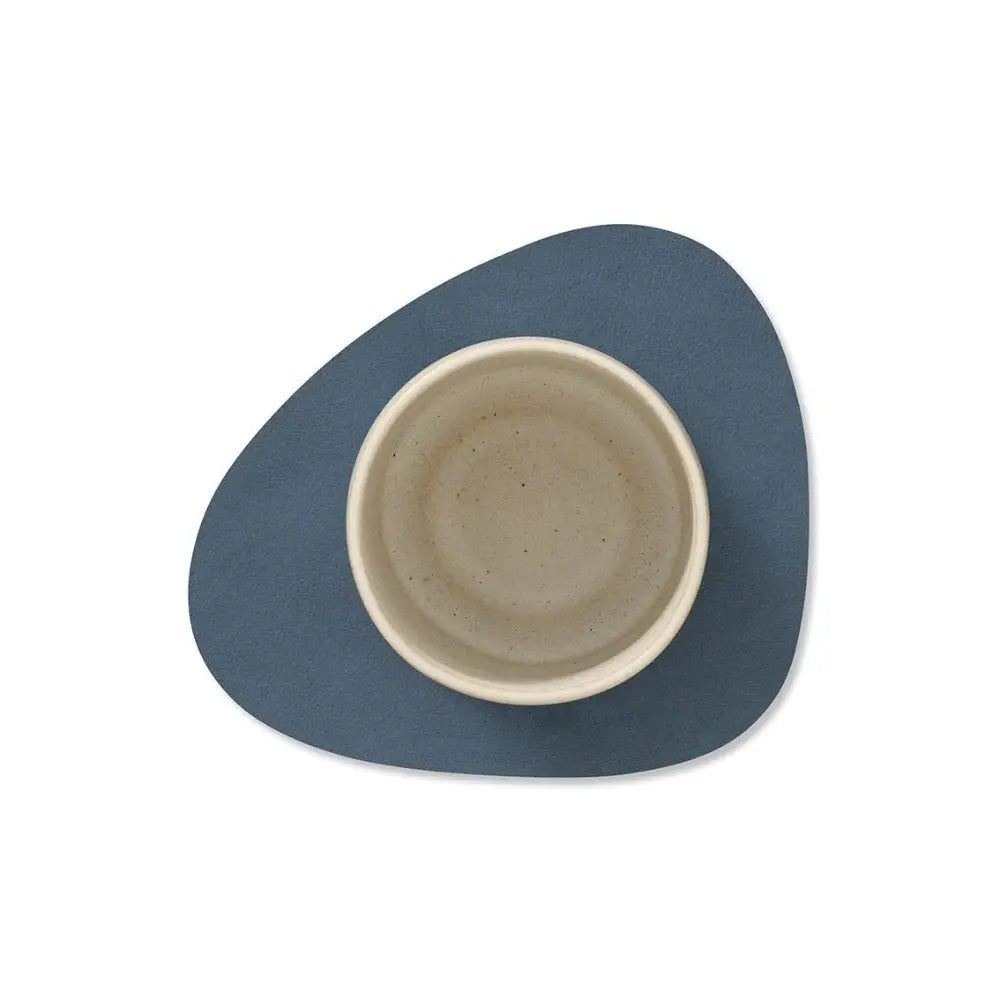 leather coaster with a smaller central bowl on a white background