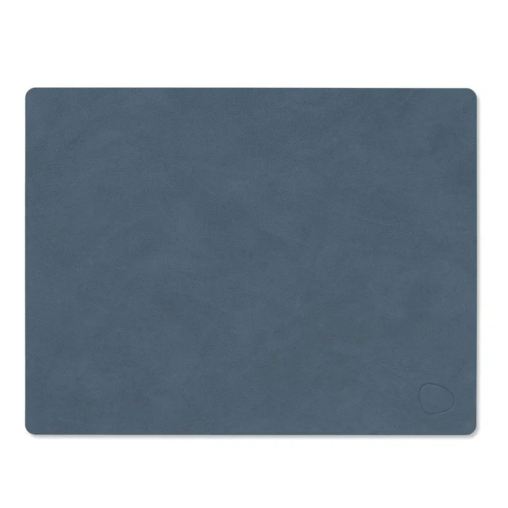 Blue textured leather placemat on a white background