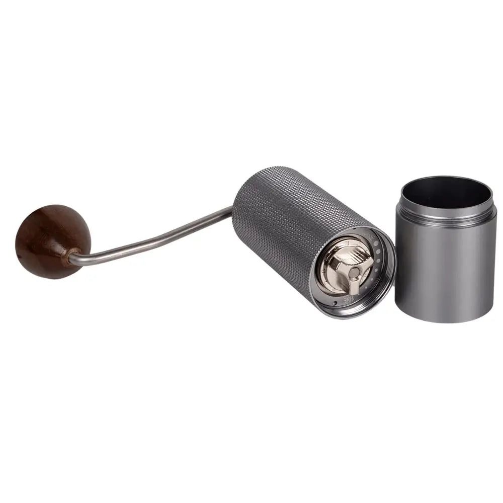 Metal coffee grinder with wooden handle on a white background