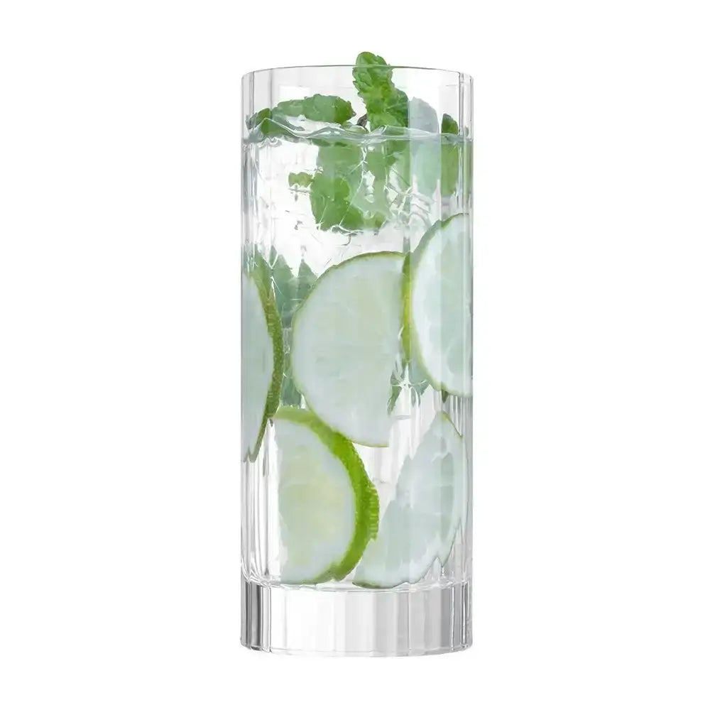 Clear glass with sliced cucumbers and mint leaves on a white background