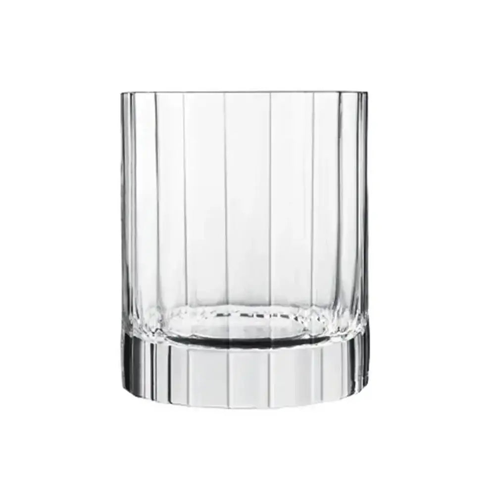 Clear glass tumbler with decorative base on a white background