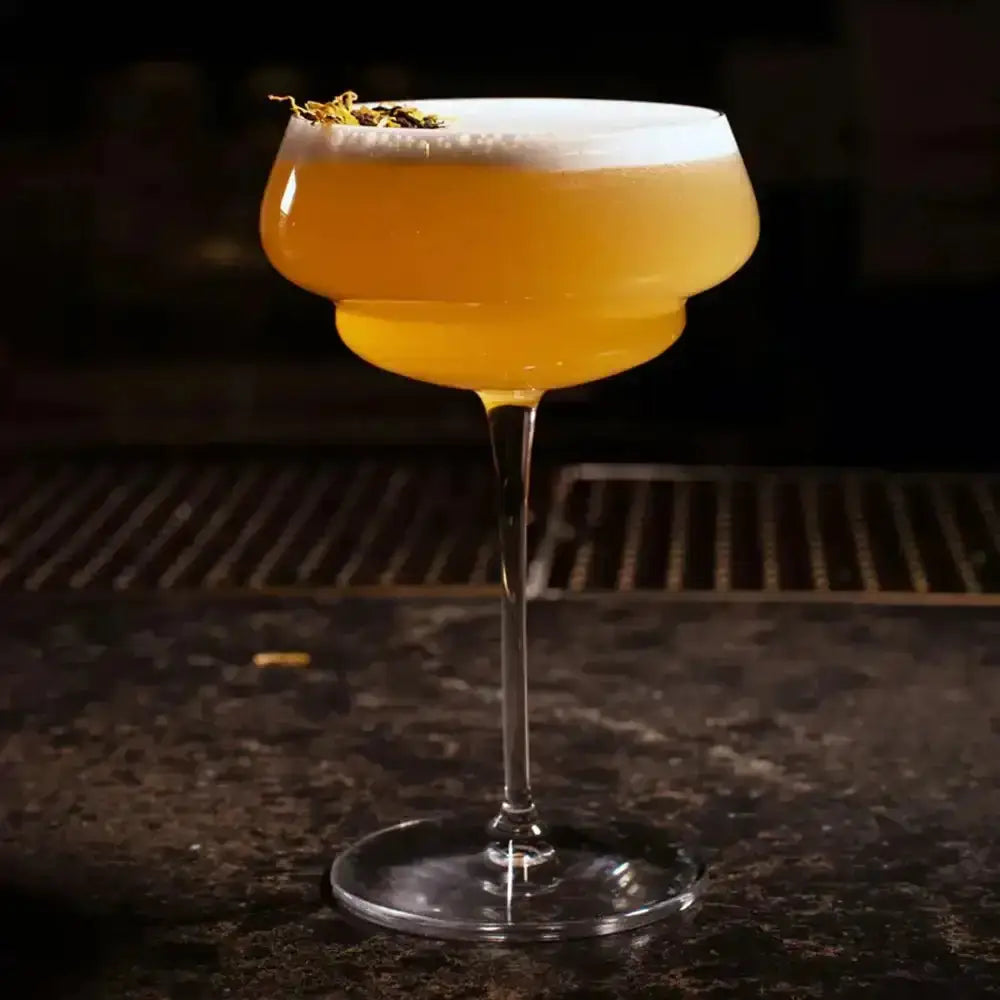 Cocktail in a glass with a dark background