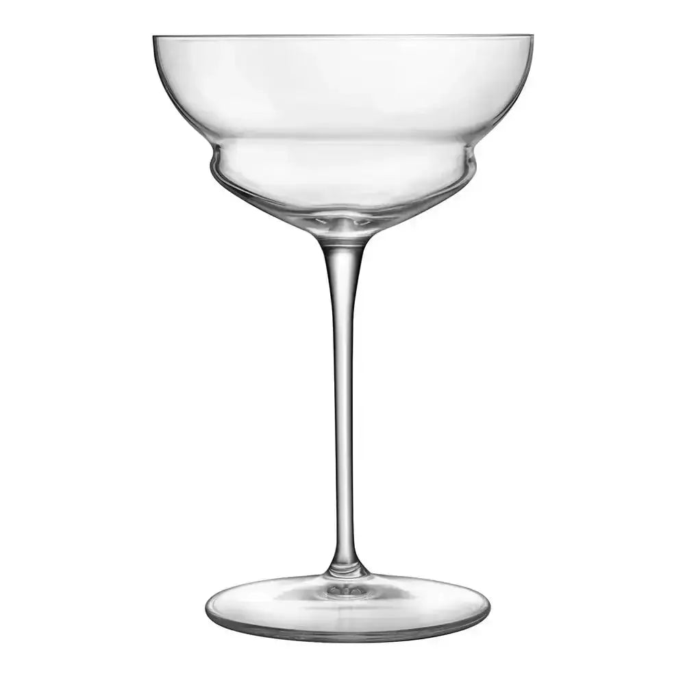 Clear glass cocktail coupe on a white background