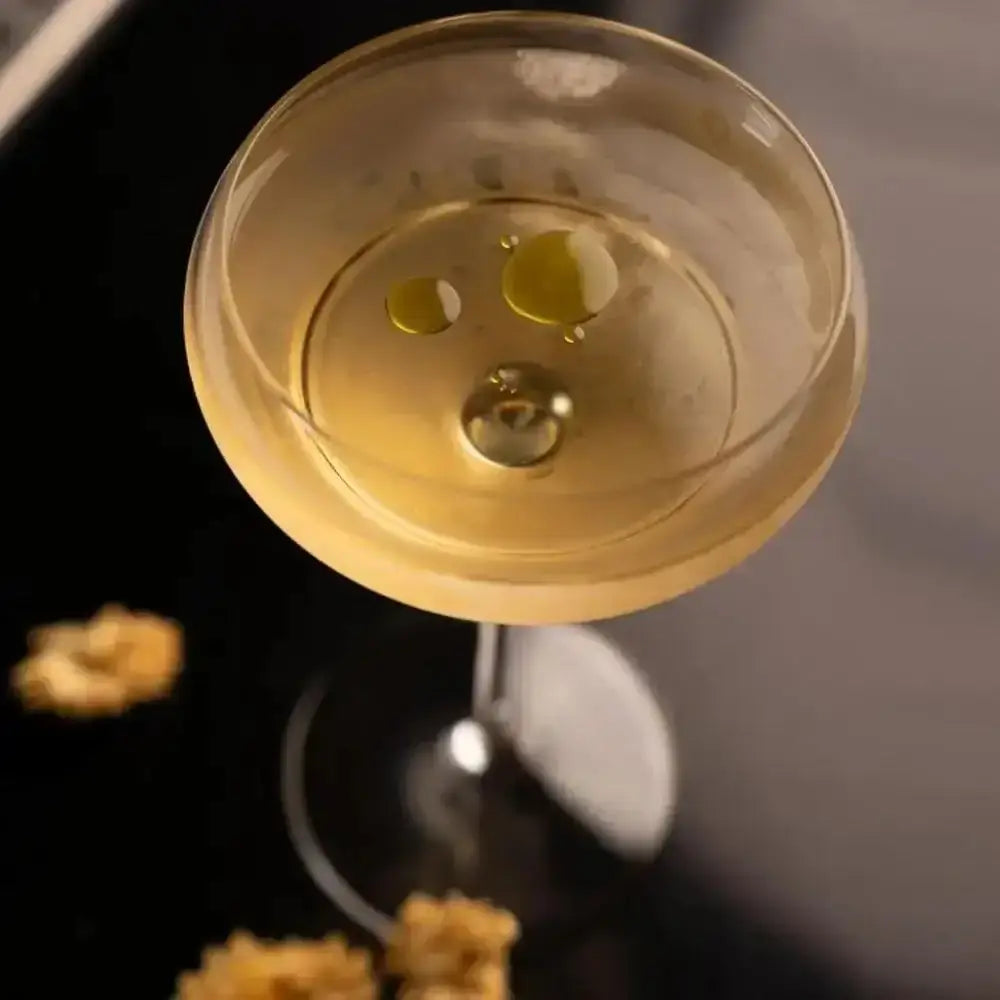 Close-up of a cocktail in a glass with a dark background