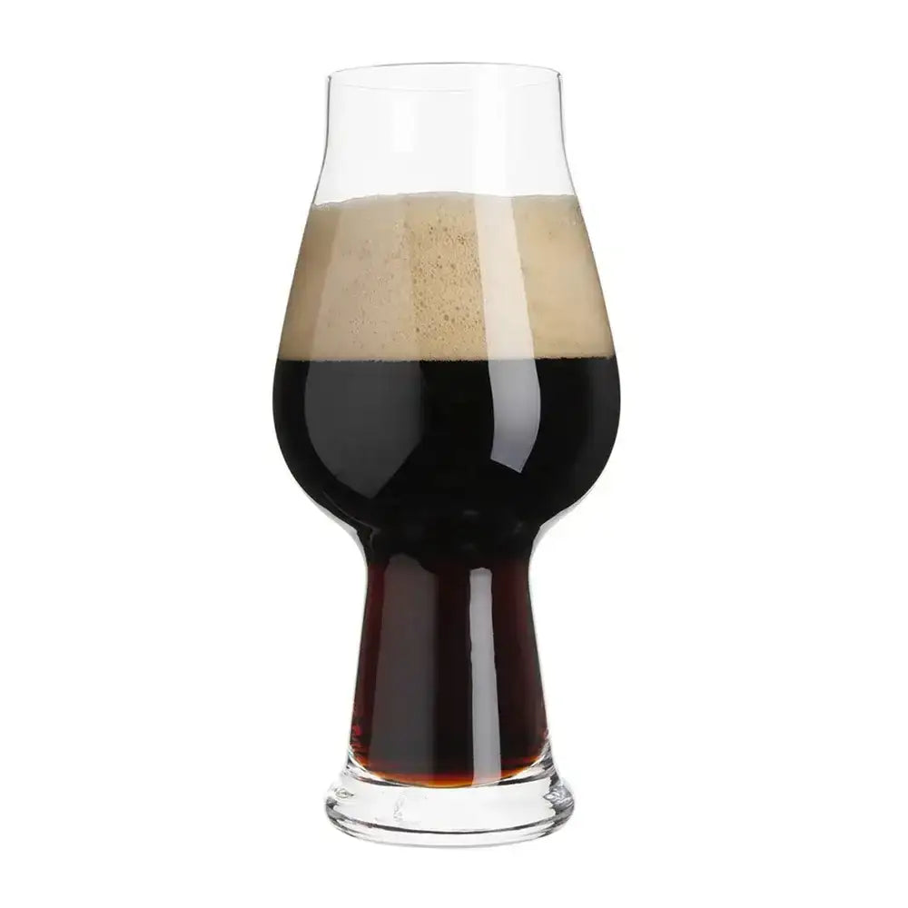 Glass of dark beer with a white background