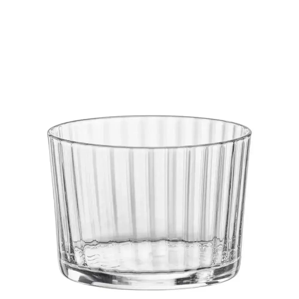 Clear glass tumbler with vertical stripes on a white background